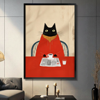 Black framed retro black cat in red turtleneck sweater sitting in a blue wicker chair reading a newspaper with a white coffee cup and glass on a red table mid-century modern illustration canvas wall art on beige wood grain background displayed in a gray living room with dark sofa and metal candlesticks