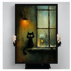 Hand-held size reference of framed black cat rainy windowsill oil painting print with glowing lantern and snowy cottage, showing portrait orientation and black frame detail