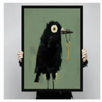 Hand-held black framed art print of dark crow with gold key hanging on string close-up product size display