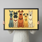 Person in cream cable-knit sweater holding a black framed cartoon five dog breeds art print in warm yellow against a light gray backdrop