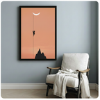 Framed terracotta-toned cat silhouette wall art with crescent moon and mountain, displayed on a blue-grey wall beside a white linen armchair