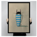 Framed canvas art print of black cat with whiskers peeking out of blue striped mug, held up showing full artwork detail and black frame