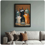 Black framed cat birthday party wall art above sofa – five expressive big-eyed cats around a celebration cake – whimsical funny pet poster for living room decor