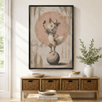 Black framed vintage circus fox acrobat balancing on a ball with a top hat and ruffled collar wall art mounted above a light wood wicker basket console with ceramic bowls, stacked books, and a tall white vase in a warm minimal entryway