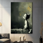 Atmospheric black and white cat with wild whiskers perched on stone ledge looking up, stretched canvas print displayed on grey wall in contemporary living room