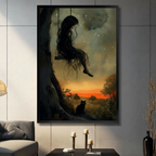 Framed dark fantasy girl with long hair on a tree swing above a black cat under a starry sunset sky wall art displayed above a console table with candlesticks in a moody grey living room