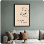 Humorous cat line art print in black frame on sage green wall above linen sofa, modern living room decor