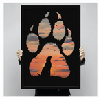 Person holding framed black Labrador silhouette inside giant dog paw print with orange red sunset and flying birds double exposure oil painting canvas – black background dramatic dog wall art size reference