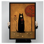 Person holding large framed folk art black cat holding red wine glass with bird perched on curled tail canvas print with both hands - close up view of whimsical black cat wine oil painting wall art with warm golden amber background red tree and black frame finish