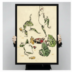 Two hands holding a large black framed Japanese ukiyo-e style illustration of five green spotted frogs at a sake party one dancing with a fan one toasting with a cup and others eating and lounging around yellow sake bottles and red lacquer bowls on vintage cream parchment background, front-facing vertical product size display
