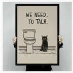 Person holding a large vertical black framed funny we need to talk black cat bathroom canvas art print showing bold blocky hand-lettered we need to talk text above a simple line art toilet and a stern black cat with amber eyes seated on a sketched wood floor in a minimalist black and warm cream palette against a light gray background