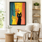 Black framed funny cats Whatcha Doing canvas art showing three nosy cartoon cats — orange, yellow, and black — with big round eyes peeking through colorful retro teal yellow and coral curtains, displayed beside a white linen armchair with a cream throw in a cozy reading nook