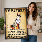 Smiling woman in a cream sweater holding a large vertical black framed retro grunge funny retired horse coffee canvas art print showing bold I'm Retired lettering above a startled wide-eyed cartoon horse with disheveled mane clutching a steaming metal coffee cup with the cheeky quote I Don't Have To I Don't Want To You Can't Make Me on a heavily distressed aged amber rust-textured background in a bright plant-filled room