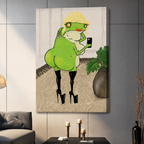 Whimsical frog selfie canvas wall art frameless gallery wrap displayed on gray panel wall with candle holders and dark sofa in contemporary living room