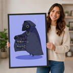 Smiling woman holding a large black-framed gothic crow art print, showcasing the hooded raven with treasure cloak design and print size in a home interior setting