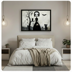 Black framed gothic canvas wall art with big-eyed girl, owl, black cat and bat motifs hung above a neutral linen bed in a minimalist bedroom with pendant lighting