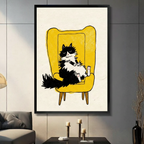 Grumpy cat canvas art in black frame displayed on grey tile wall with candle and sofa