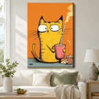 Black-framed canvas print of a grumpy yellow cat clutching a pink coffee mug with a straw on a vibrant orange background, displayed above a rattan storage console in a bright modern entryway
