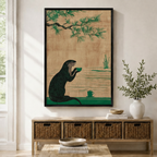 Japanese style otter drinking tea wall art print in black frame displayed above wooden console with wicker baskets