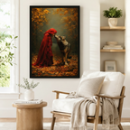 Dark fantasy framed art print showing a woman in a flowing red cloak leaning toward a grey wolf amid fallen autumn leaves, styled beside a linen armchair in a reading nook