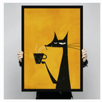 Hands holding a large black framed canvas art print of a stylized black cat with long whiskers and a grumpy face clutching a hot coffee cup, retro pop art illustration on a vivid amber yellow textured background against a light gray backdrop