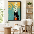 Black framed retro grunge black cat coffee canvas art showing a bug-eyed fluffy black cartoon cat sitting upright and clutching a bright orange coffee mug with a large swirling cream steam cloud rising dramatically on a distressed teal and golden orange mottled background, displayed on a white wall beside a white wooden armchair with a cream fringed throw and a round wood side table with stacked books