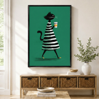 Black framed retro chic black cat with coffee canvas art with a sleek black cat in a bold black and white striped A-line dress striding confidently while holding a takeaway coffee cup on a vibrant emerald green background, displayed above a rattan storage console in a bright entryway
