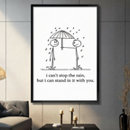Framed minimalist stick figure couple sharing umbrella in rain canvas print on dark grey tile wall in modern living room - sweet i can't stop the rain but i can stand in it with you quote wall art in black and white for contemporary home decor