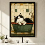 Framed canvas wall art of a fluffy tuxedo cat lounging in a vintage green bathtub with retro tile background, displayed above a bathroom vanity