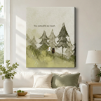 Stretched canvas wall art of a tender watercolor scene featuring a white cat and a black dog side by side in a foggy evergreen forest meadow with the quote you complete my heart in muted sage and misty gray washes, hung in a bright living room above a cream sofa with a sage green pillow and a gray ceramic table lamp