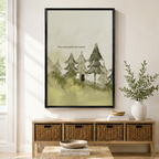 Black framed watercolor you complete my heart white cat and black dog canvas art with a small white cat and black dog standing together on a misty pine forest slope forming a heart shape beside the hand-lettered quote you complete my heart in soft sage green tones, displayed on a light wall above a wooden rattan storage console with a white vase of greenery