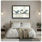 Blue birds on wire watercolour framed canvas art above a bed with white linen bedding, a taupe throw blanket, white nightstands, potted plants, and globe pendant lights