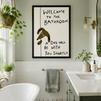 Witty dog bathroom wall art in black frame styled above a freestanding bathtub in a bright white subway tile bathroom with brass accents and hanging plants