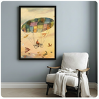 Black framed whimsical watercolor cyclist parachute canvas art print with a man on a bicycle soaring under a multicolored patchwork canopy amid golden sky and colorful birds on a blue-grey wall beside a white linen armchair with draped throw