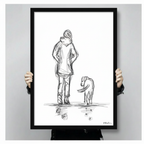 Two hands holding a black framed woman and dog pencil sketch print, clearly showing print dimensions, frame depth, and line art detail
